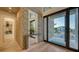 Bright and airy foyer with a stone accent wall and hardwood floors at 1206 Blue Shell Loop, Sarasota, FL 34240