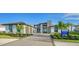 Modern home with a stone facade, two-car garage, and manicured landscaping at 1206 Blue Shell Loop, Sarasota, FL 34240