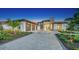 Stunning curb appeal with a modern design, landscaped grounds, and a paved driveway at 1206 Blue Shell Loop, Sarasota, FL 34240