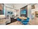 Game room with seating area, game table and fireplace at 1206 Blue Shell Loop, Sarasota, FL 34240