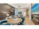 Game room with seating, game table, and fireplace at 1206 Blue Shell Loop, Sarasota, FL 34240