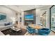 Bright game room with seating area, game table, and fireplace at 1206 Blue Shell Loop, Sarasota, FL 34240