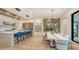 Modern kitchen with island and dining area at 1206 Blue Shell Loop, Sarasota, FL 34240
