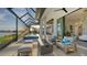Outdoor lanai with fire pit and pool access at 1206 Blue Shell Loop, Sarasota, FL 34240
