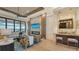 Bright living room featuring a fireplace and access to backyard at 1206 Blue Shell Loop, Sarasota, FL 34240