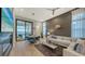 Spacious living room with comfortable seating, fireplace, and water views at 1206 Blue Shell Loop, Sarasota, FL 34240