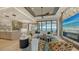 Open living area with kitchen and water views at 1206 Blue Shell Loop, Sarasota, FL 34240