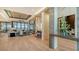 Spacious living area with hardwood floors, fireplace, and water views at 1206 Blue Shell Loop, Sarasota, FL 34240
