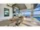 Outdoor kitchen with water views and built-in grill at 1206 Blue Shell Loop, Sarasota, FL 34240