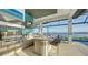 Luxury outdoor kitchen with stainless steel appliances and lake views at 1206 Blue Shell Loop, Sarasota, FL 34240