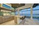 Modern outdoor kitchen with lake view at 1206 Blue Shell Loop, Sarasota, FL 34240