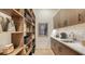 Well-organized pantry with custom shelving and a coffee bar at 1206 Blue Shell Loop, Sarasota, FL 34240