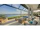 Outdoor patio with fire pit and lake view at 1206 Blue Shell Loop, Sarasota, FL 34240