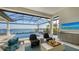 Relaxing pool area with comfortable seating and a water view at 1206 Blue Shell Loop, Sarasota, FL 34240