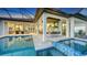 Relaxing pool and spa with outdoor kitchen and seating at 1206 Blue Shell Loop, Sarasota, FL 34240