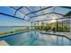 Resort-style pool with a spa and a screened enclosure at 1206 Blue Shell Loop, Sarasota, FL 34240