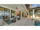 Relaxing patio area with seating, overlooking the pool and waterfront views at 1206 Blue Shell Loop, Sarasota, FL 34240