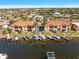 Two-story building with attached garages, private pool, and boat docks at 1323 Mediterranean Dr # 111, Punta Gorda, FL 33950