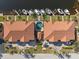 Aerial view of two-story building with pool, parking, and boat slips at 1323 Mediterranean Dr # 111, Punta Gorda, FL 33950