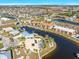 Aerial view showcasing waterfront community and boat docks at 1323 Mediterranean Dr # 111, Punta Gorda, FL 33950