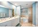 Spa-like bathroom with double vanity and soaking tub at 1323 Mediterranean Dr # 111, Punta Gorda, FL 33950