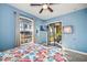 Bedroom with king-size bed and private balcony access at 1323 Mediterranean Dr # 111, Punta Gorda, FL 33950