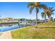 Brick-paved pathway to a boat lift on the canal at 1323 Mediterranean Dr # 111, Punta Gorda, FL 33950