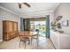Dining area with table and chairs, access to patio at 1323 Mediterranean Dr # 111, Punta Gorda, FL 33950