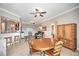 Open concept dining area with table and chairs at 1323 Mediterranean Dr # 111, Punta Gorda, FL 33950