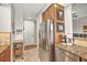 Kitchen includes stainless steel refrigerator and coffee maker at 1323 Mediterranean Dr # 111, Punta Gorda, FL 33950