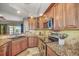 Kitchen boasts granite countertops, stainless steel appliances, and ample cabinetry at 1323 Mediterranean Dr # 111, Punta Gorda, FL 33950