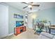Home office with a large TV, desk, and ample space for two monitors at 1323 Mediterranean Dr # 111, Punta Gorda, FL 33950