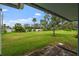 Large backyard with lush green lawn at 1348 Westport Ln # 1405, Sarasota, FL 34232