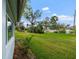 Spacious backyard with mature trees and lawn at 1348 Westport Ln # 1405, Sarasota, FL 34232