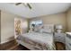 Bright bedroom with king-size bed and ensuite bathroom access at 1348 Westport Ln # 1405, Sarasota, FL 34232