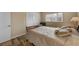 Cozy bedroom with a queen-size bed and wood floors at 1348 Westport Ln # 1405, Sarasota, FL 34232