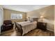 Bright bedroom with a queen-size bed and wood floors at 1348 Westport Ln # 1405, Sarasota, FL 34232