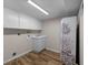 Laundry room with washer/dryer hookups and cabinets at 1348 Westport Ln # 1405, Sarasota, FL 34232