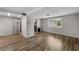 Spacious living room with kitchen views and wood floors at 1348 Westport Ln # 1405, Sarasota, FL 34232