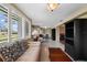 Bright sun room with plantation shutters, a comfortable sofa, and seamless access to the outdoors at 1348 Westport Ln # 1405, Sarasota, FL 34232