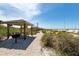 Beachfront picnic tables under gazebos, steps from the beach at 15312 Spanish Point Dr, Port Charlotte, FL 33981