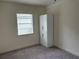 Spacious bedroom with large closet and window with blinds at 1630 29Th St, Sarasota, FL 34234