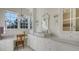 Bright bathroom with a large vanity, white cabinets, and a white sink at 1714 Irving St, Sarasota, FL 34236