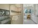 Spa-like bathroom with a walk-in shower, vanity, and white cabinets at 1714 Irving St, Sarasota, FL 34236