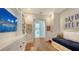 Charming bedroom with built-in shelving, daybed, and hardwood floors at 1714 Irving St, Sarasota, FL 34236