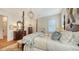 Spacious bedroom with a four-poster bed and hardwood floors at 1714 Irving St, Sarasota, FL 34236