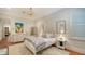 Charming bedroom with white bedding and hardwood floors at 1714 Irving St, Sarasota, FL 34236