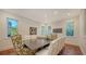 Bright dining room features a ping pong table and charming floral chairs at 1714 Irving St, Sarasota, FL 34236