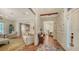 Open concept entryway with herringbone floors and views into adjacent rooms at 1714 Irving St, Sarasota, FL 34236
