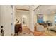 Bright entryway with herringbone floors, bird wallpaper, and seating area at 1714 Irving St, Sarasota, FL 34236